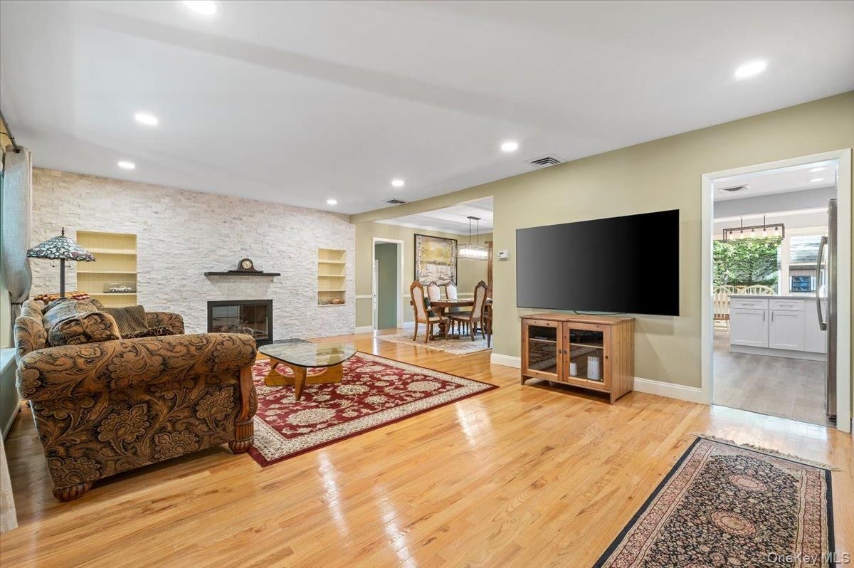 Dining room, Fireplace, Interior, Living room, Pendant Lights, Recessed Lighting, Stone Walls, Wood Texture Flooring