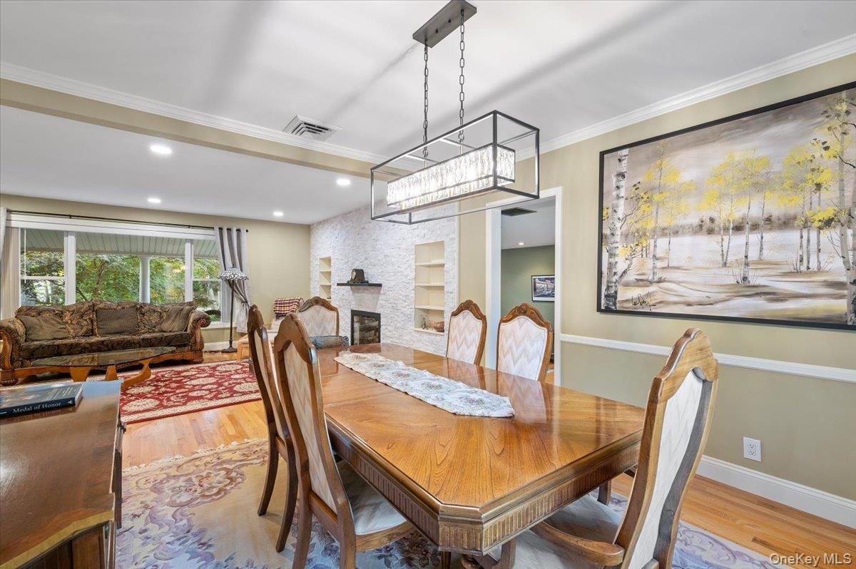 Dining room, Fireplace, Interior, Living room, Pendant Lights, Recessed Lighting, Stone Walls, Wood Texture Flooring