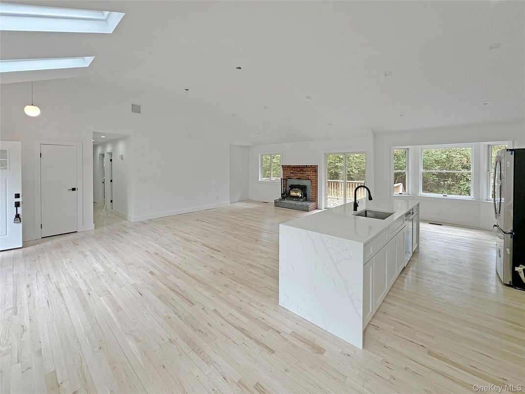 Empty room, Fireplace, Interior, Kitchen, Pendant Lights, Recessed Lighting, Wood Texture Flooring