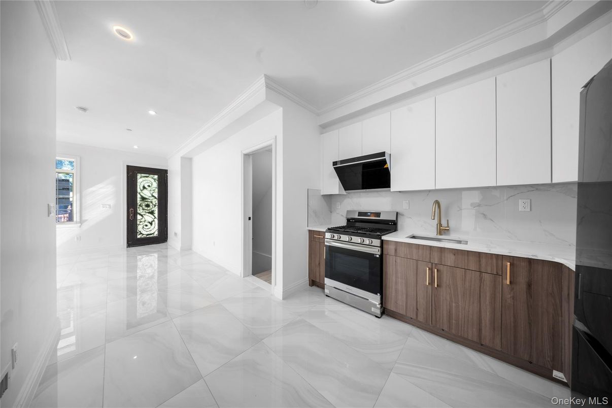 Interior, Kitchen, Marble Walls, Recessed Lighting, Stainless Steel Appliances