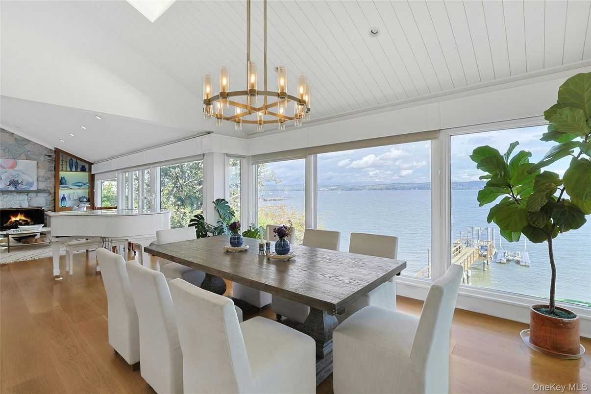 Dining room, Fireplace, Interior, Living room, Pendant Lights, Recessed Lighting, Water, Wood Texture Flooring
