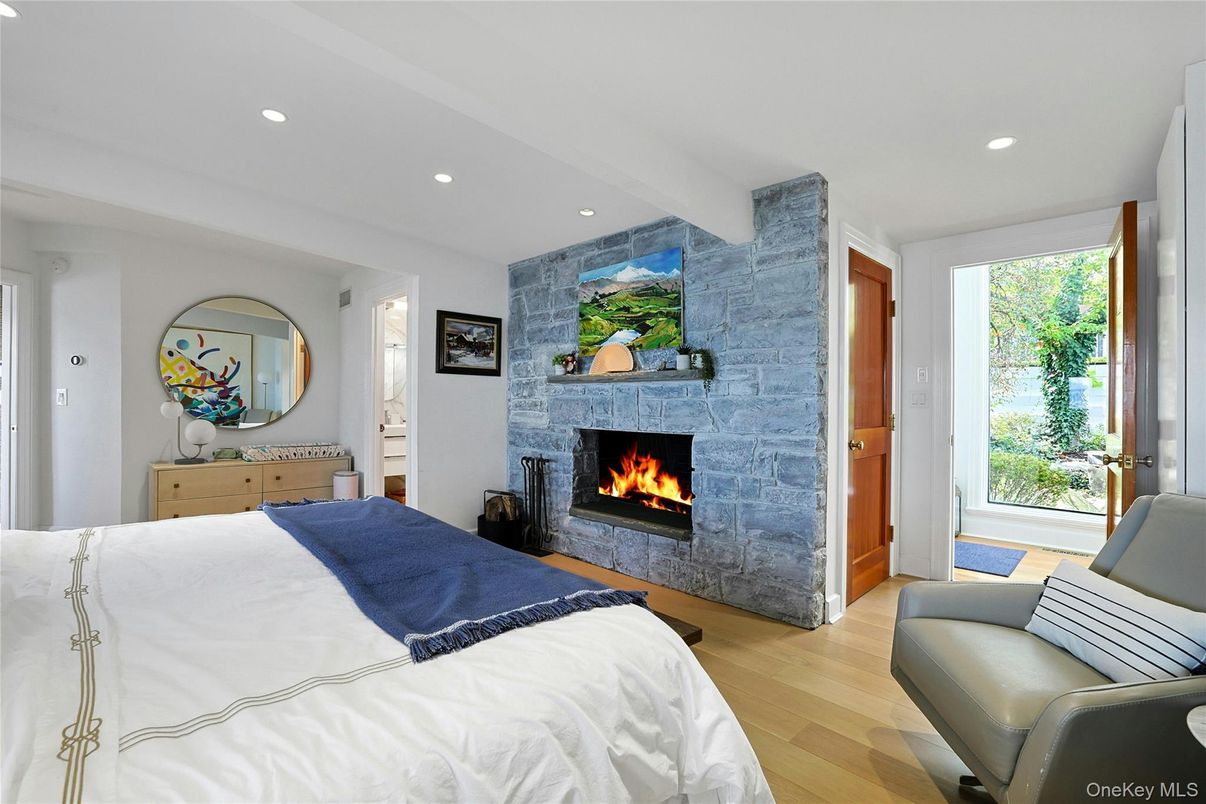 Bedroom, Fireplace, Interior, Recessed Lighting, Stone Walls, Wood Texture Flooring