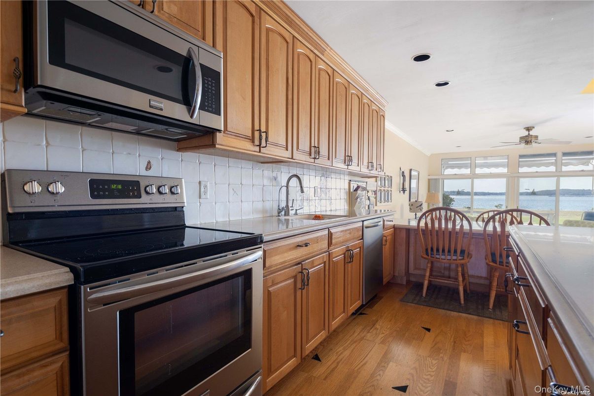 Dining room, Interior, Kitchen, Recessed Lighting, Stainless Steel Appliances, Water, Wood Texture Flooring