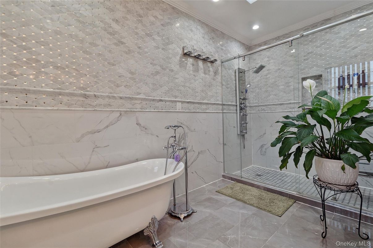 Bathroom, Free Standing Baths, Glass Shower, Interior, Marble Walls, Recessed Lighting