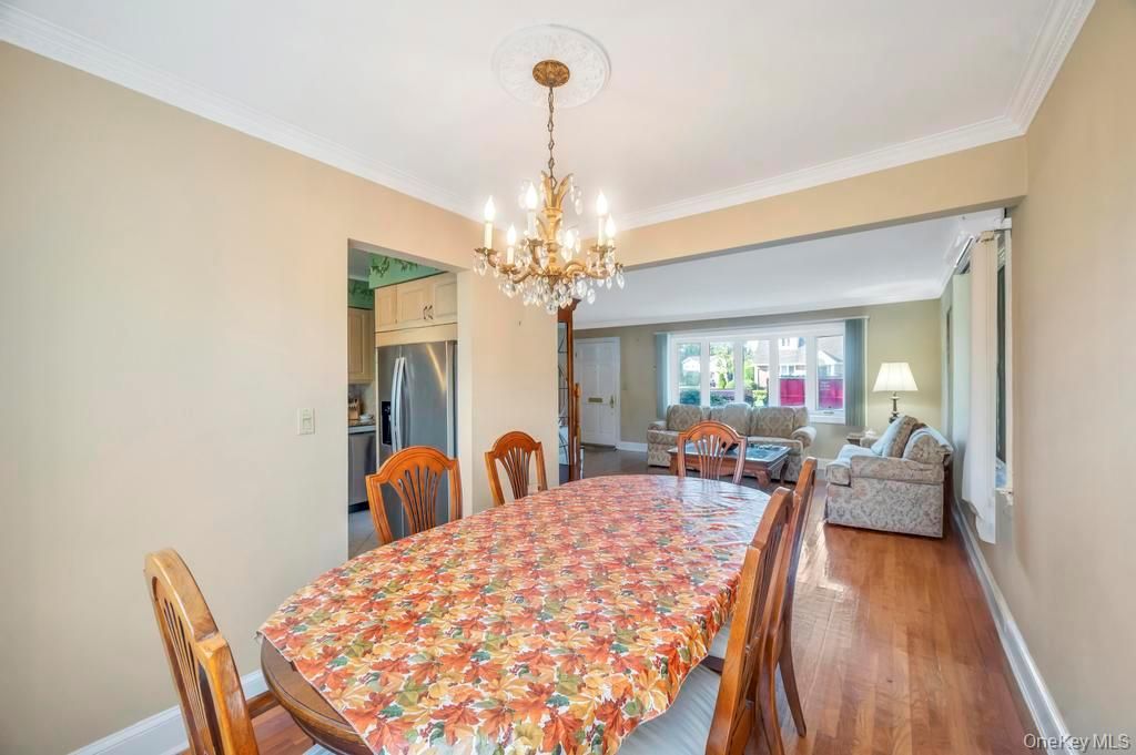 Chandelier, Dining room, Interior, Kitchen, Living room, Stainless Steel Appliances, Wood Texture Flooring