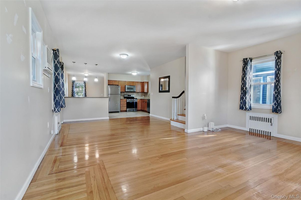Empty room, Interior, Kitchen, Pendant Lights, Stainless Steel Appliances, Wood Texture Flooring