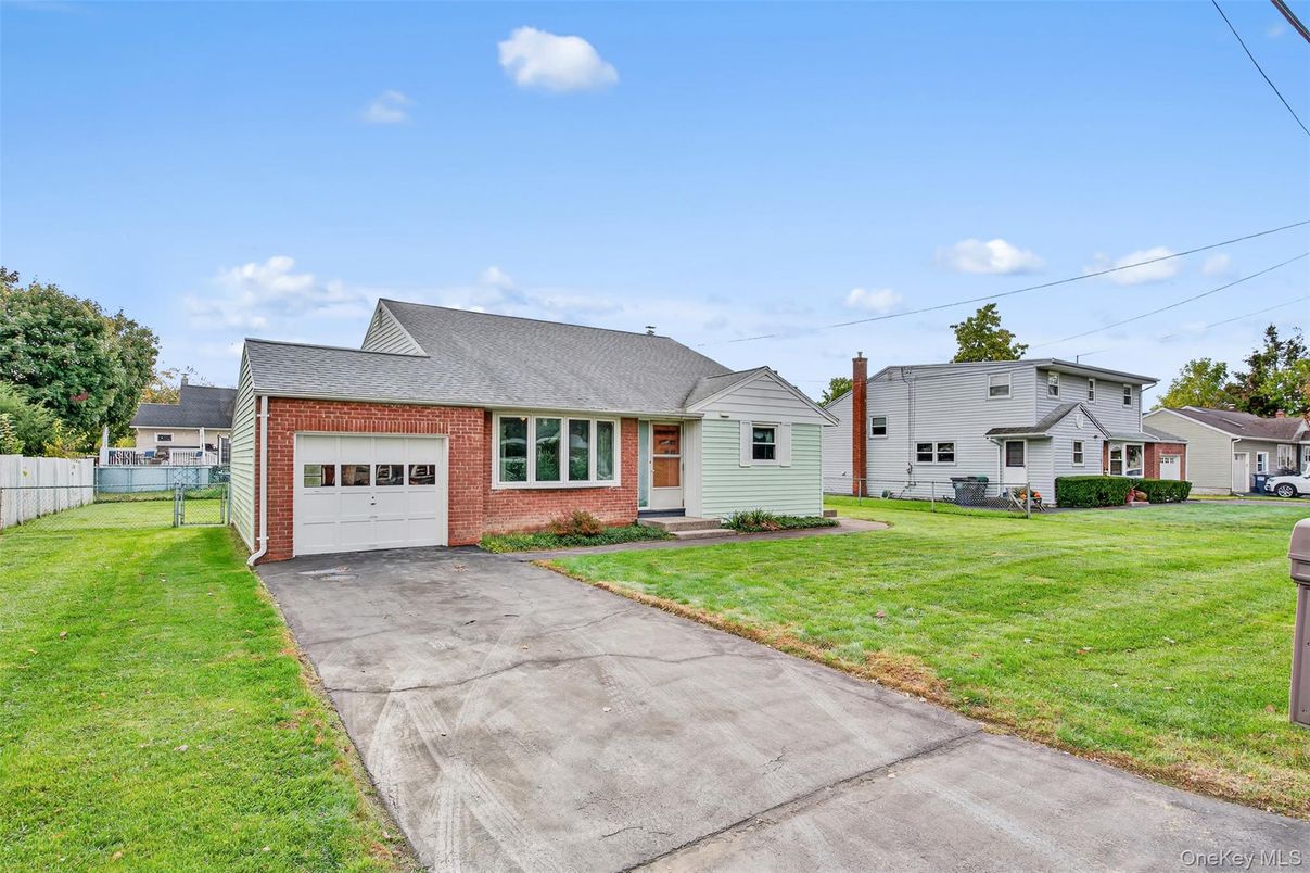 Attached, Backyard, Exterior, Facade, Brick Facade, Cape Cod