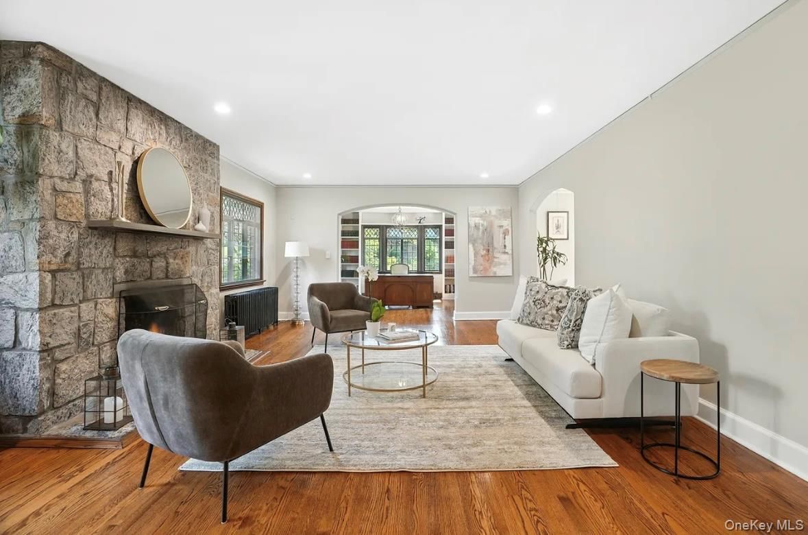 Fireplace, Interior, Living room, Recessed Lighting, Stone Walls, Wood Texture Flooring