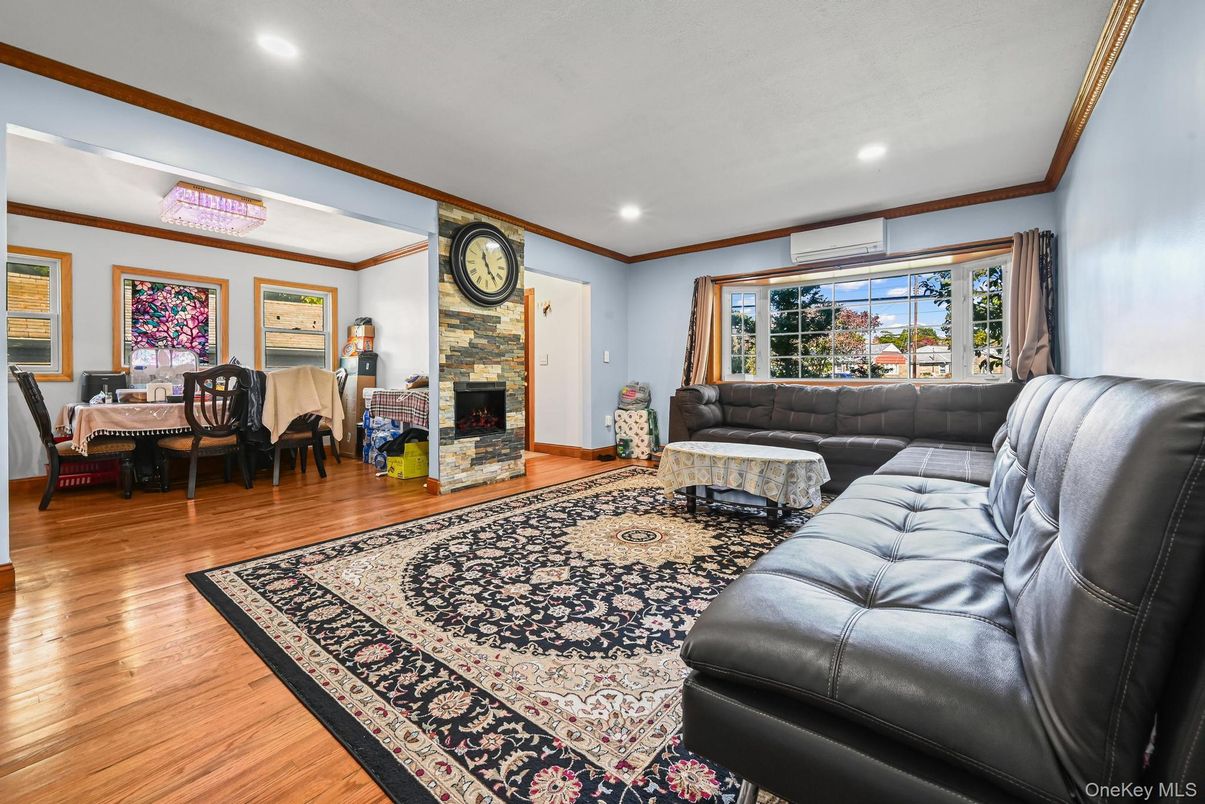 Dining room, Fireplace, Interior, Living room, Recessed Lighting, Wood Texture Flooring