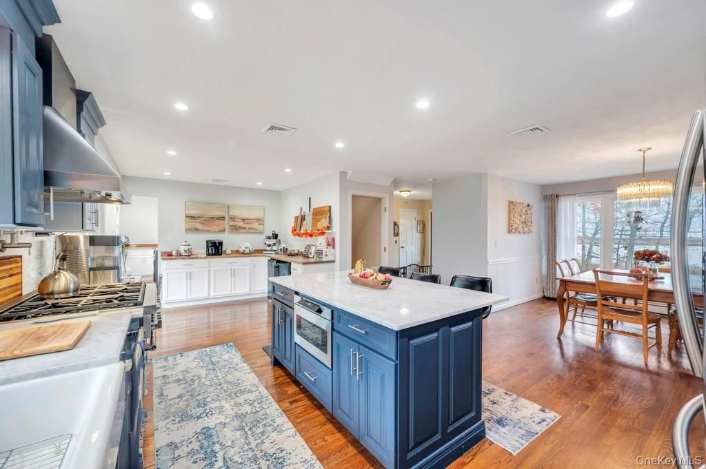Chandelier, Dining room, Interior, Kitchen, Recessed Lighting, Stainless Steel Appliances, Wood Texture Flooring