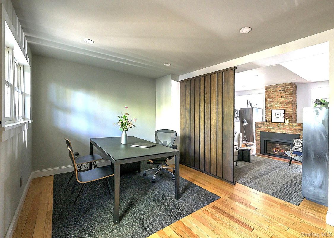 Dining room, Fireplace, Interior, Recessed Lighting, Stone Walls, Wood Texture Flooring