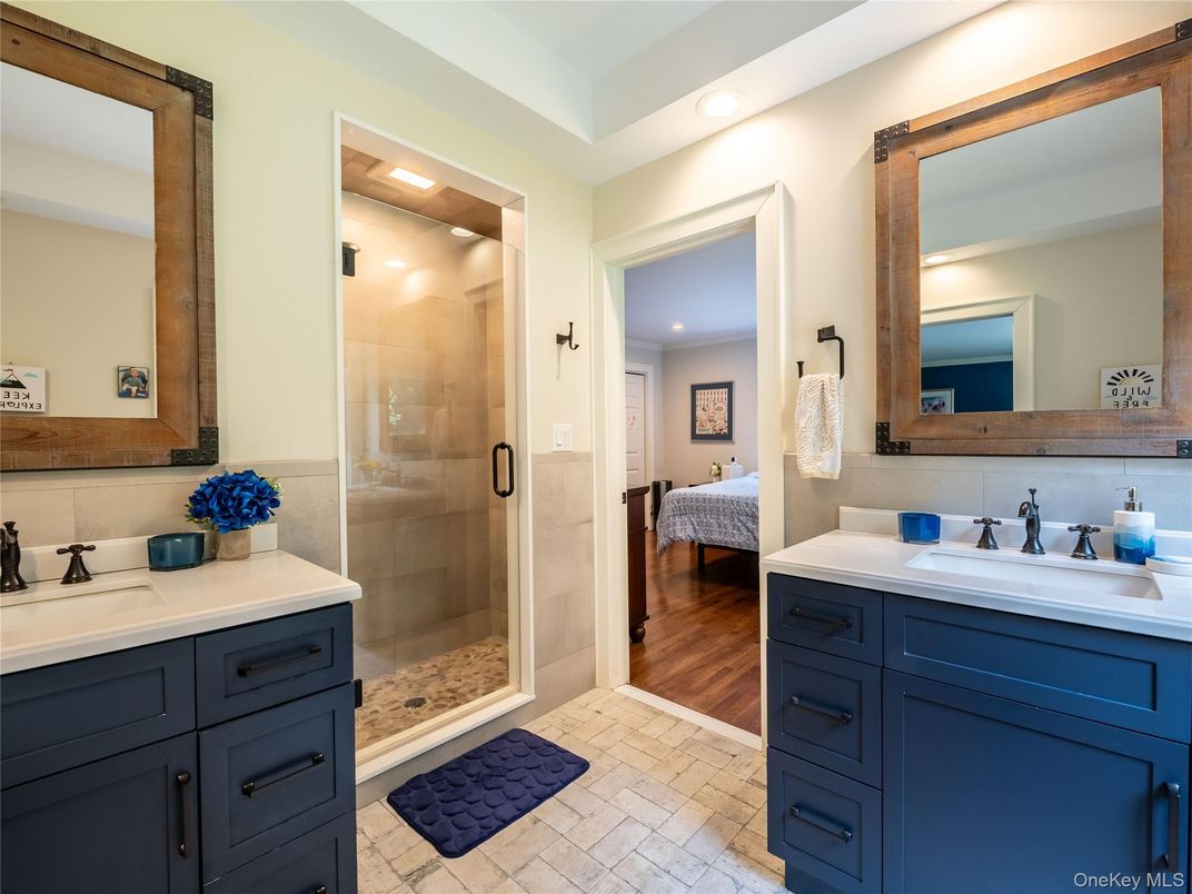 Bathroom, Dual Sink Vanities, Glass Shower, Interior, Recessed Lighting, Wood Texture Flooring