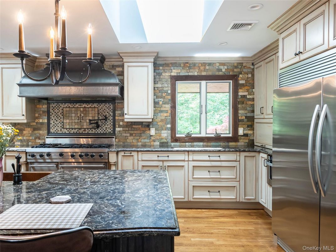 Chandelier, Interior, Kitchen, Recessed Lighting, Stainless Steel Appliances, Stone Walls, Wood Texture Flooring