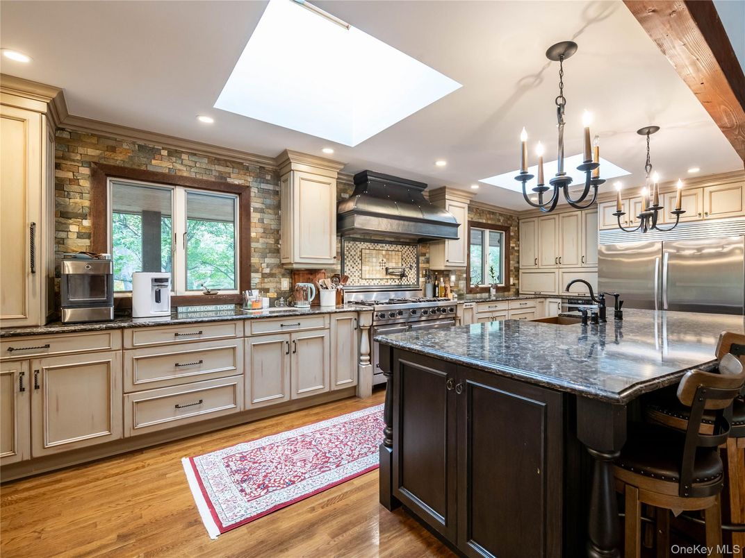 Chandelier, Interior, Kitchen, Recessed Lighting, Stainless Steel Appliances, Stone Walls, Wood Texture Flooring
