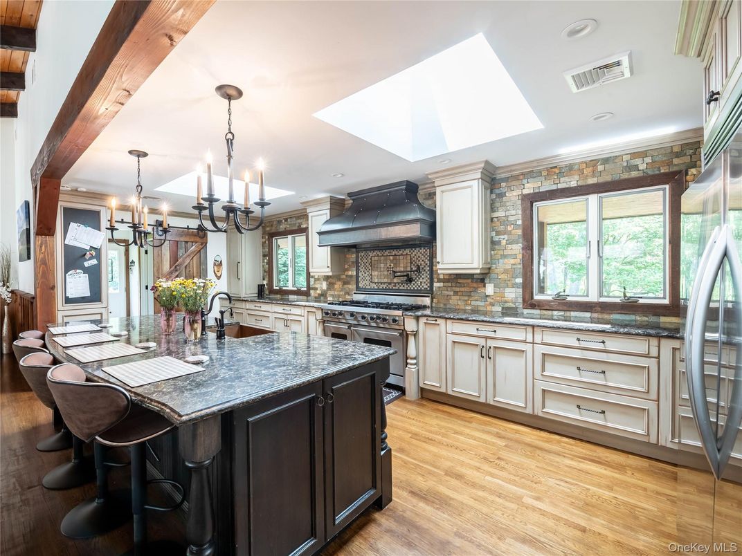 Chandelier, Interior, Kitchen, Pendant Lights, Recessed Lighting, Stainless Steel Appliances, Stone Walls, Wooden Beams, Wood Texture Flooring