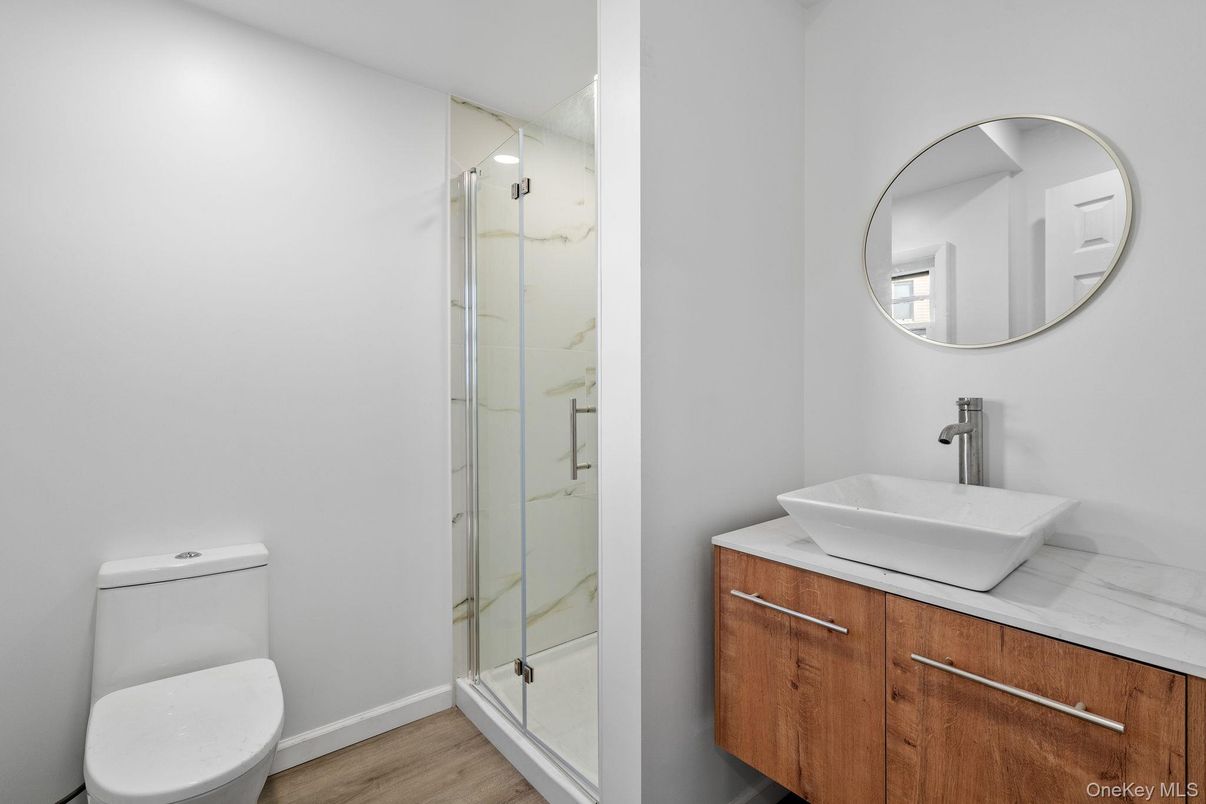 Bathroom, Glass Shower, Interior, Marble Walls, Wood Texture Flooring