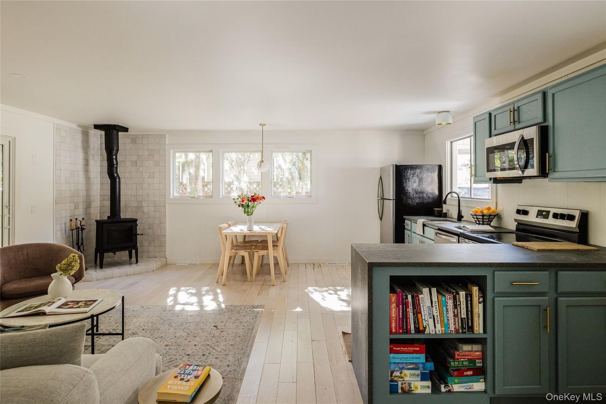 Dining room, Fireplace, Interior, Kitchen, Pendant Lights, Stone Walls, Wood Texture Flooring