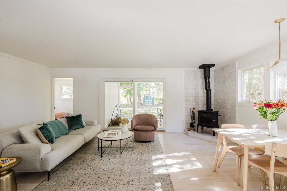 Dining room, Fireplace, Interior, Living room, Pendant Lights, Stone Walls, Wood Texture Flooring