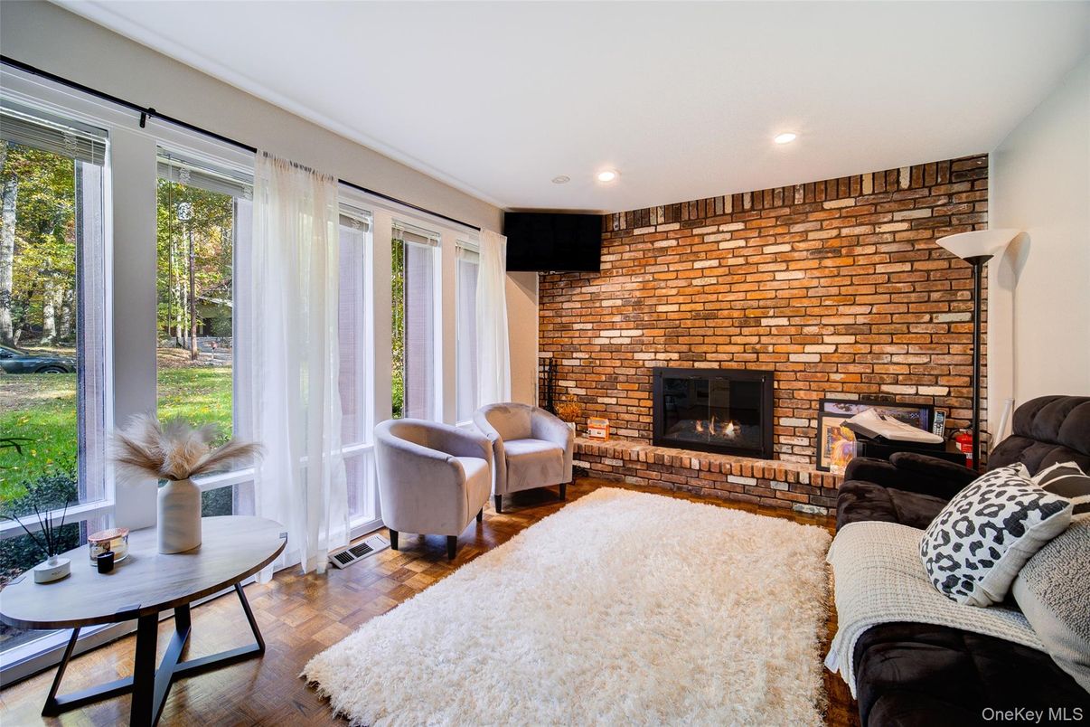 Fireplace, Interior, Living room, Recessed Lighting, Stone Walls, Wood Texture Flooring