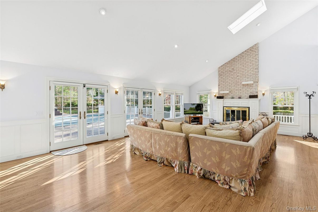 Fireplace, Interior, Living room, Recessed Lighting, Stone Walls, Wood Texture Flooring