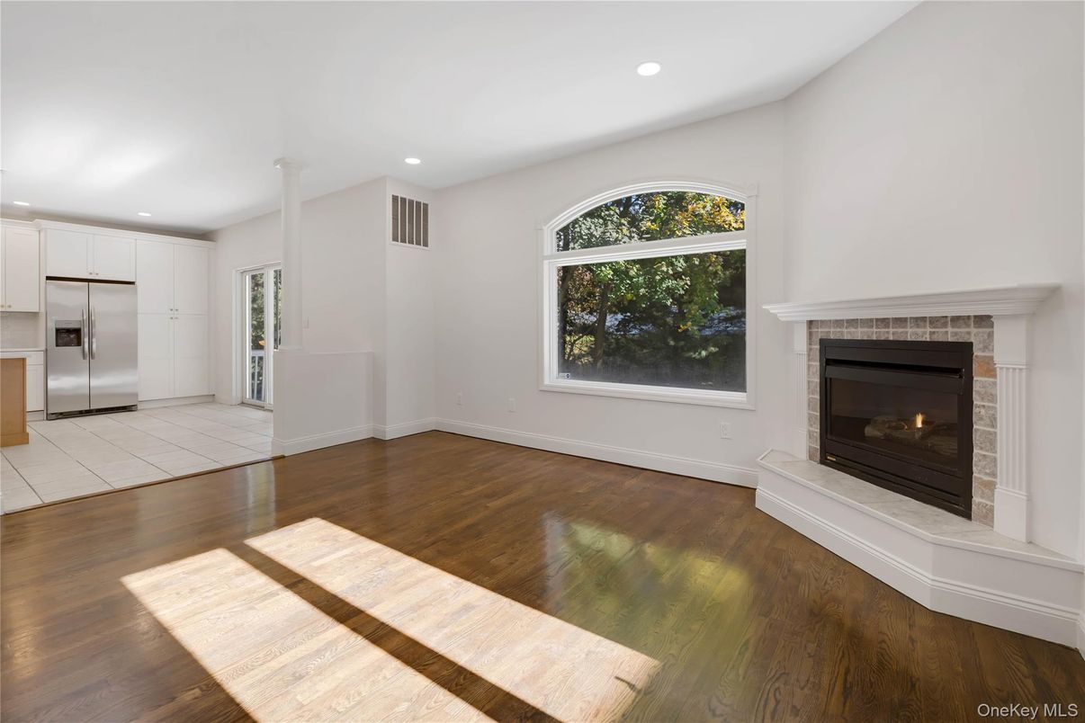 Empty room, Fireplace, Interior, Kitchen, Recessed Lighting, Wood Texture Flooring