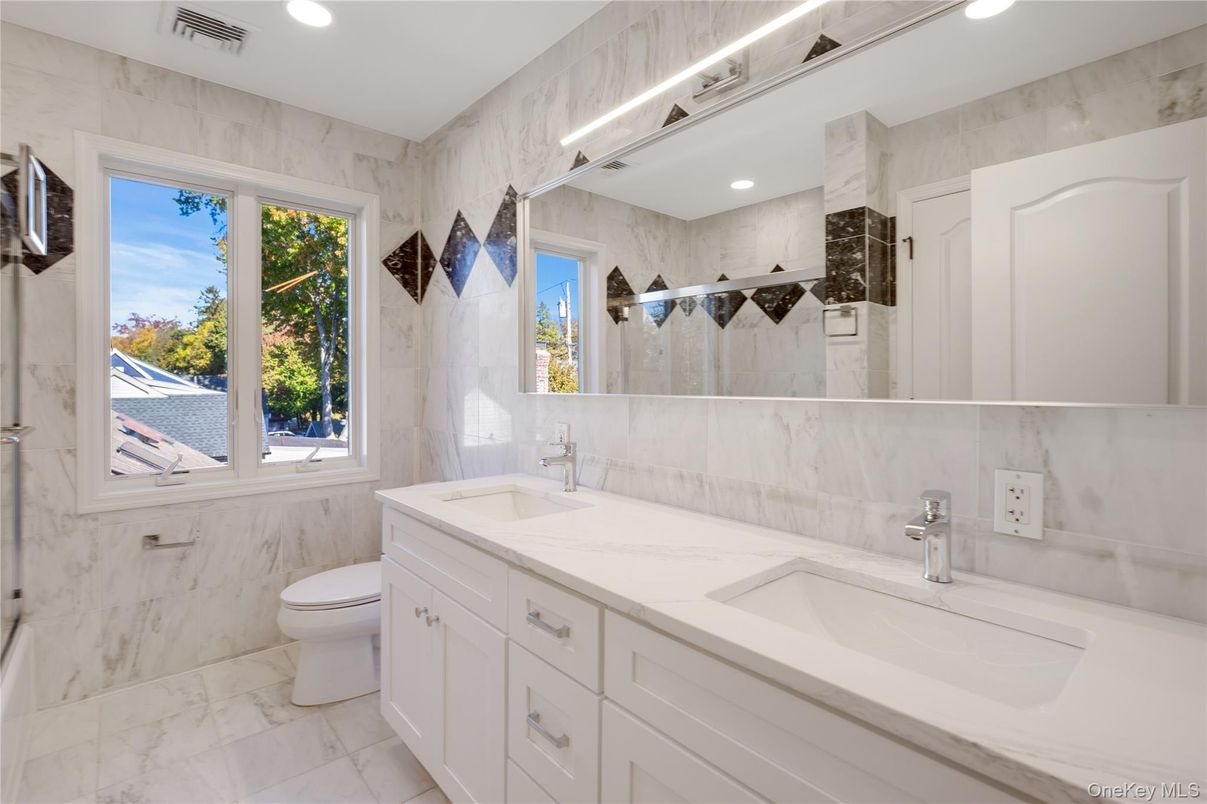 Bathroom, Dual Sink Vanities, Interior, Marble, Marble Walls, Recessed Lighting