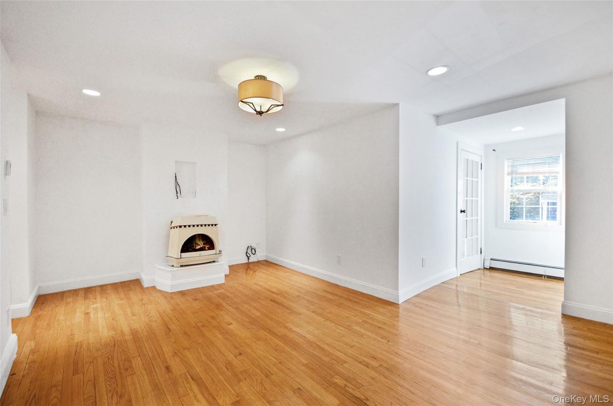 Empty room, Fireplace, Interior, Recessed Lighting, Wood Texture Flooring
