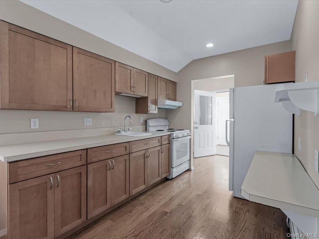 Interior, Kitchen, Recessed Lighting, Washer, Wood Texture Flooring