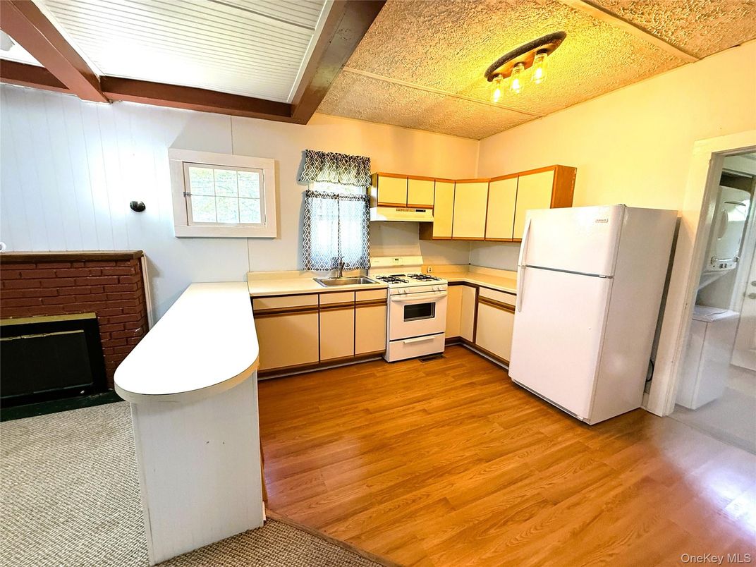 Fireplace, Interior, Kitchen, Stainless Steel Appliances, Wood Texture Flooring