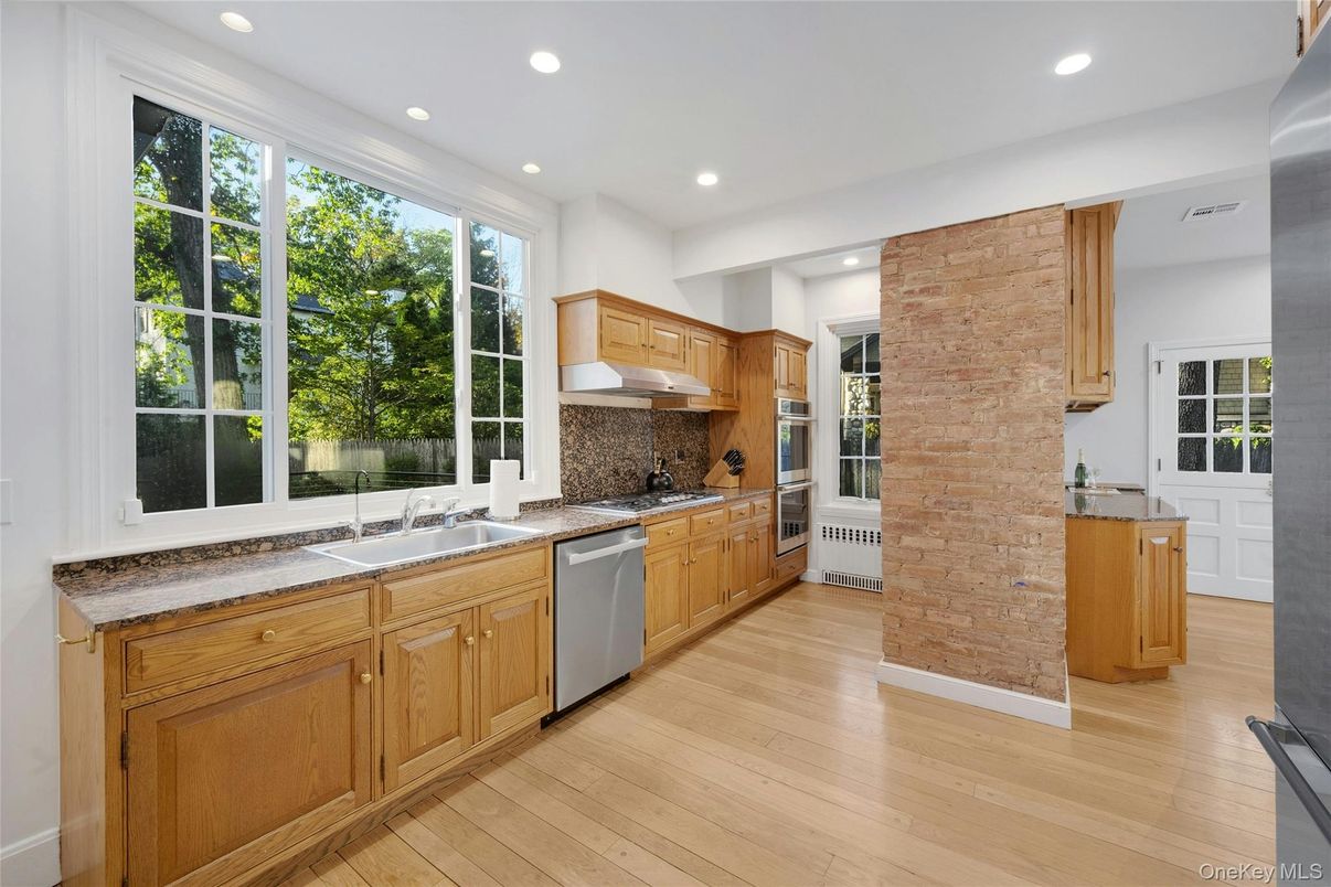 Interior, Kitchen, Recessed Lighting, Stainless Steel Appliances, Stone Walls, Wood Texture Flooring