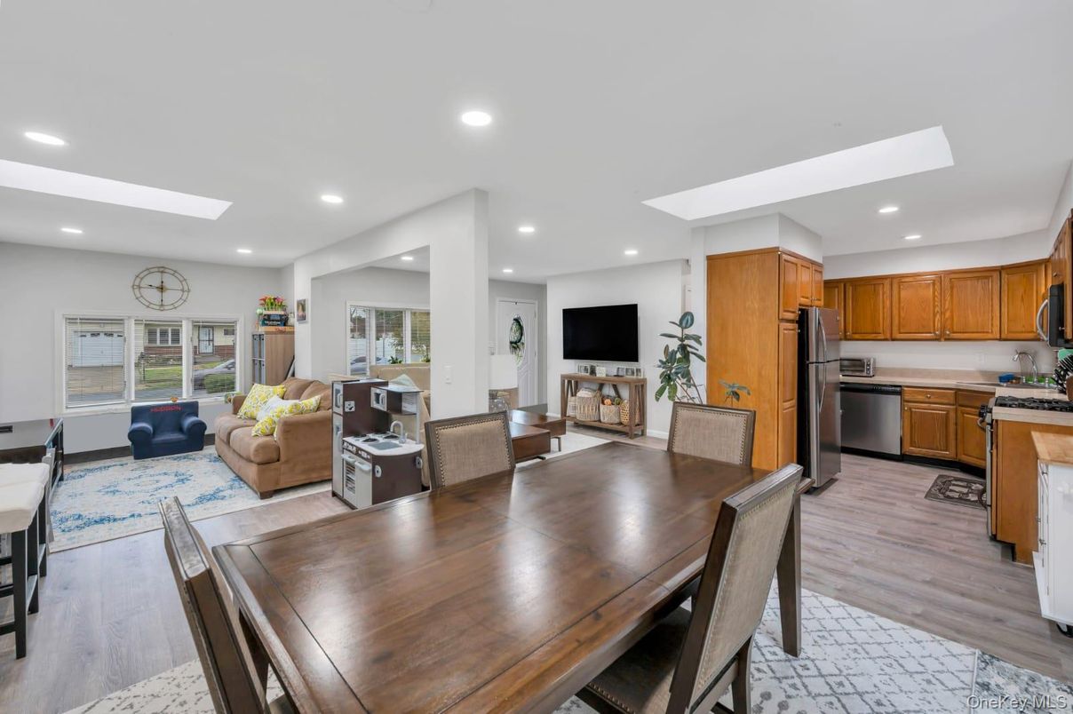 Dining room, Interior, Kitchen, Living room, Recessed Lighting, Stainless Steel Appliances, Wood Texture Flooring