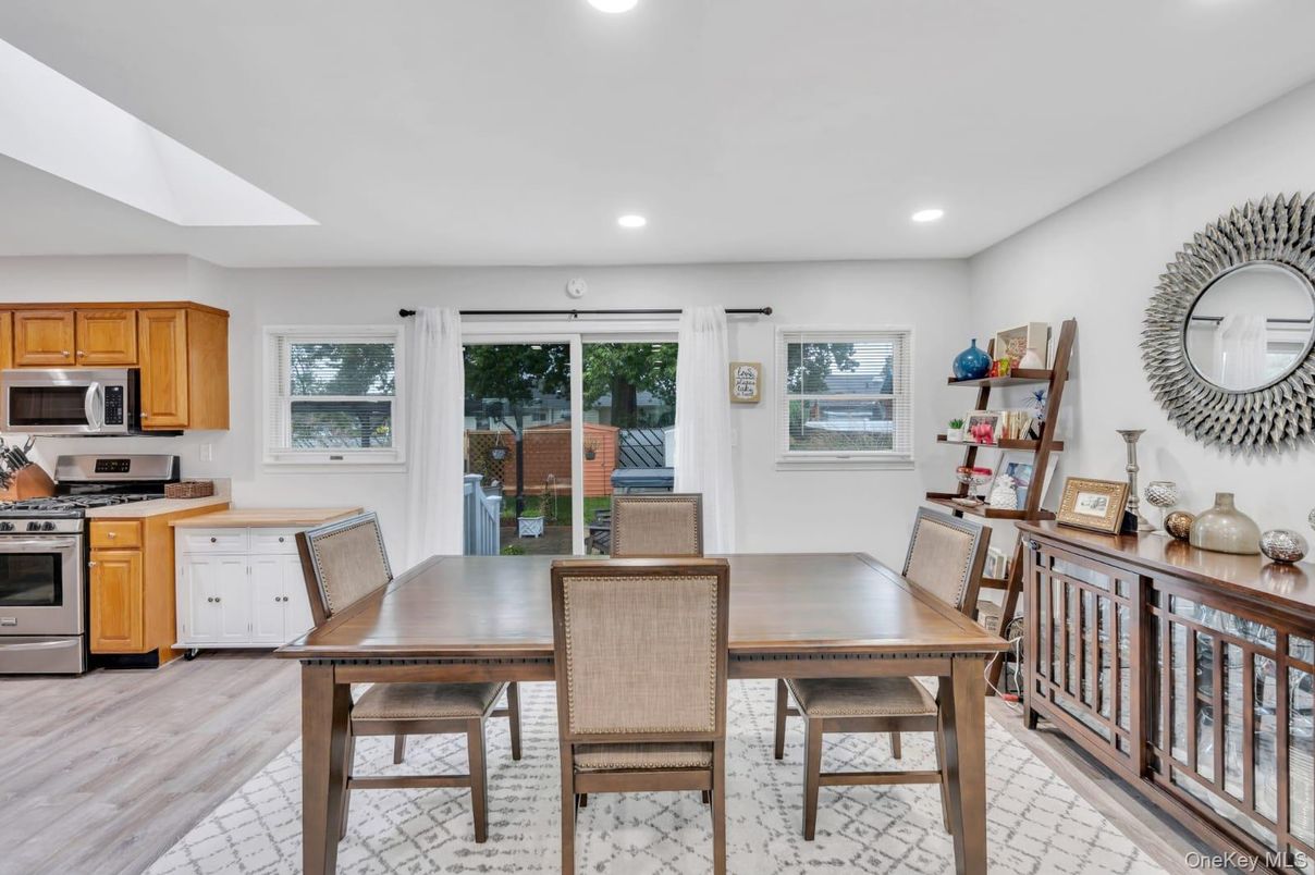Dining room, Interior, Kitchen, Recessed Lighting, Stainless Steel Appliances, Wood Texture Flooring