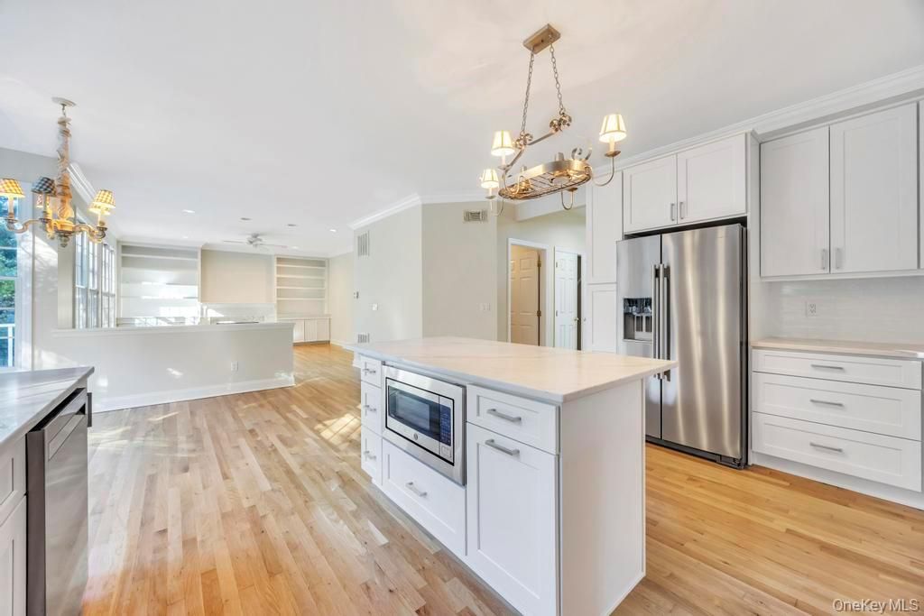 Chandelier, Interior, Kitchen, Pendant Lights, Recessed Lighting, Stainless Steel Appliances, Wood Texture Flooring