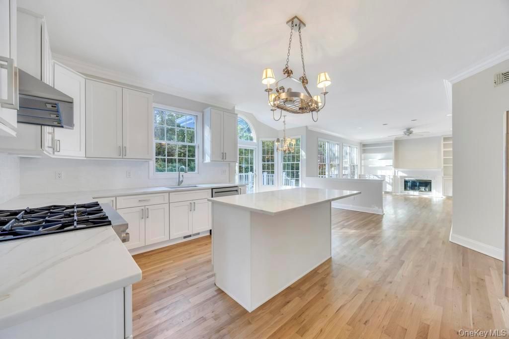 Chandelier, Fireplace, Interior, Kitchen, Recessed Lighting, Wood Texture Flooring