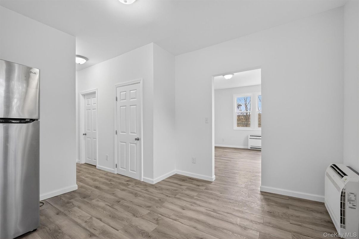 Empty room, Interior, Kitchen, Stainless Steel Appliances, Wood Texture Flooring