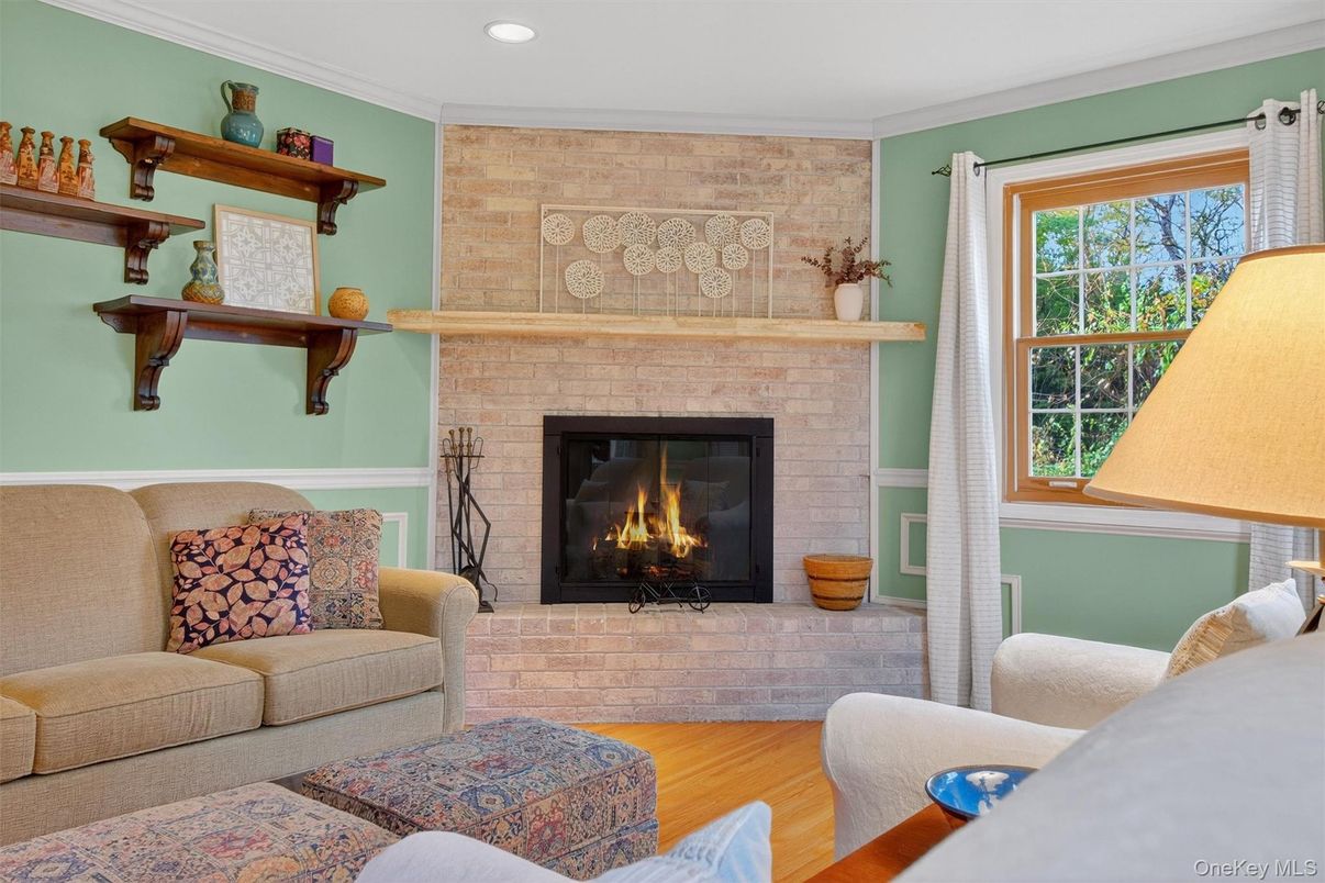 Fireplace, Interior, Living room, Recessed Lighting, Stone Walls, Wood Texture Flooring