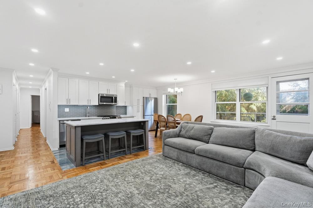 Chandelier, Dining room, Interior, Kitchen, Living room, Recessed Lighting, Stainless Steel Appliances, Wood Texture Flooring