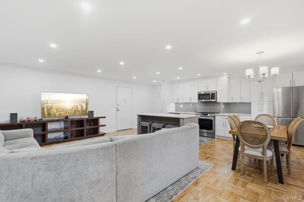 Chandelier, Dining room, Interior, Kitchen, Recessed Lighting, Stainless Steel Appliances, Wood Texture Flooring