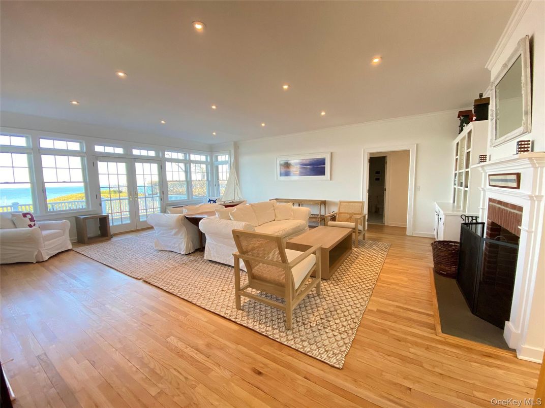 Fireplace, Interior, Living room, Recessed Lighting, Water, Wood Texture Flooring