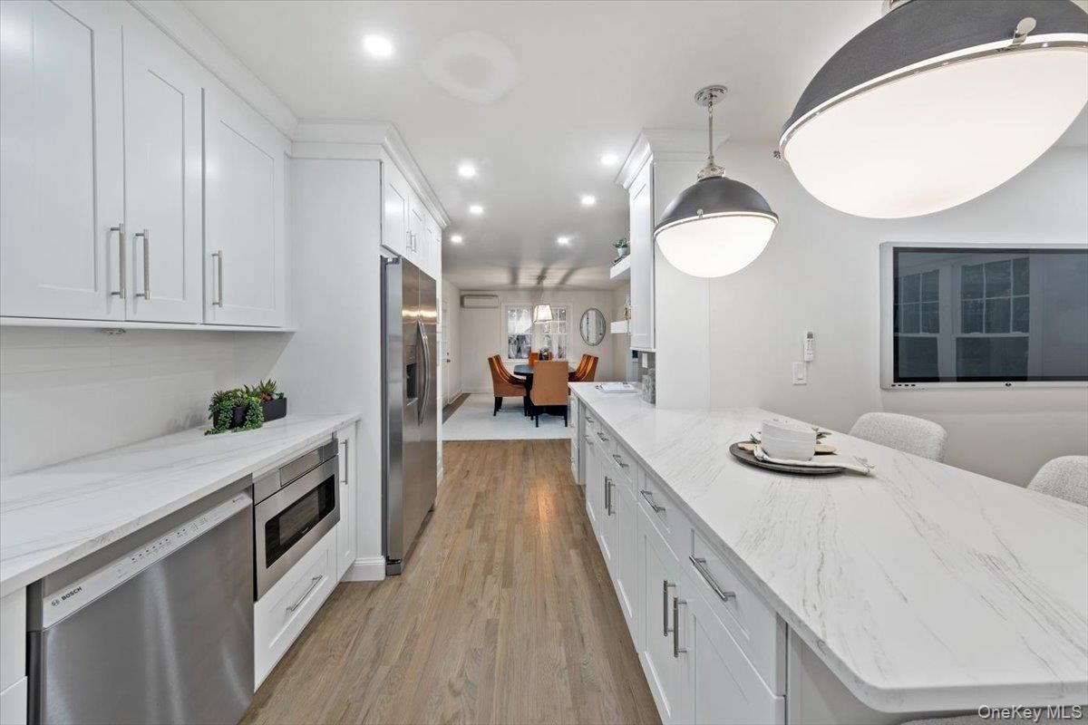 Dining room, Interior, Kitchen, Pendant Lights, Recessed Lighting, Stainless Steel Appliances, Wood Texture Flooring