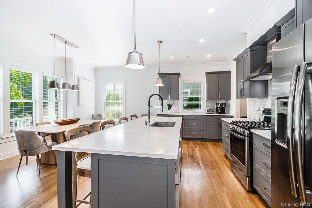 Dining room, Interior, Kitchen, Pendant Lights, Recessed Lighting, Stainless Steel Appliances, Wood Texture Flooring