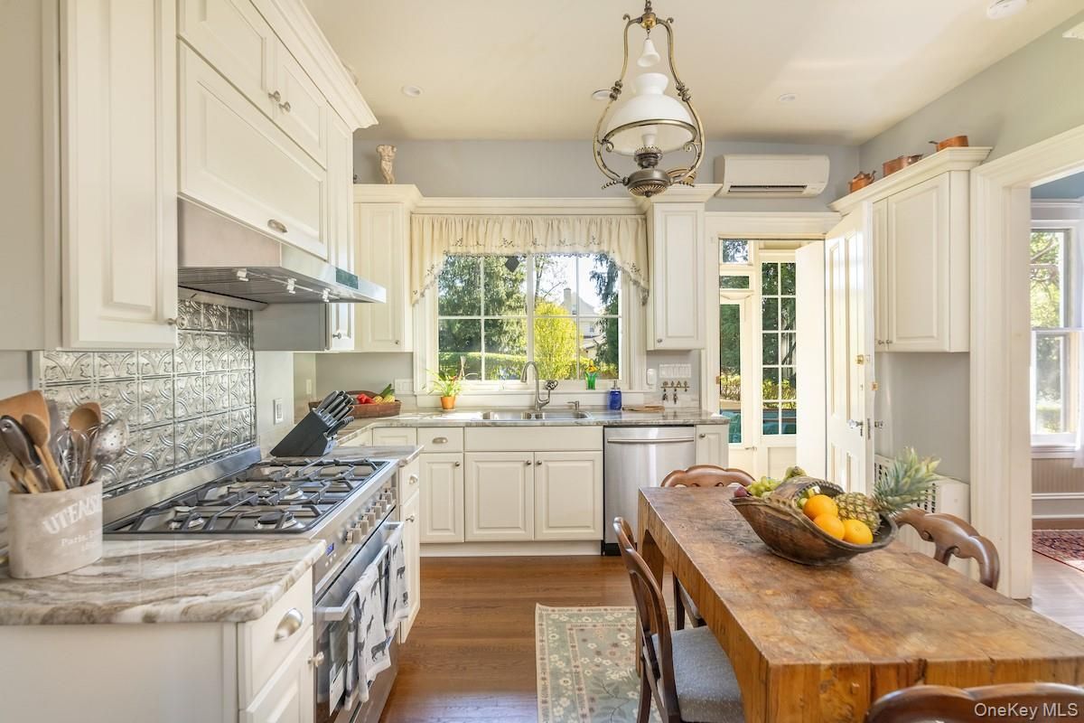Chandelier, Interior, Kitchen, Pendant Lights, Recessed Lighting, Stainless Steel Appliances, Wood Texture Flooring