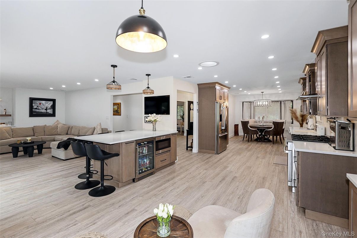 Dining room, Interior, Kitchen, Living room, Pendant Lights, Recessed Lighting, Stainless Steel Appliances, Wood Texture Flooring