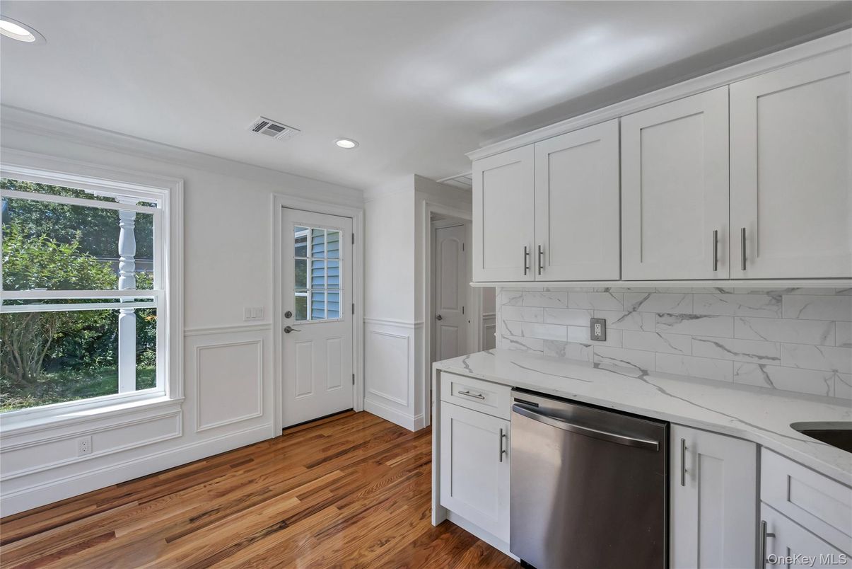 Interior, Kitchen, Marble Walls, Recessed Lighting, Stainless Steel Appliances, Wood Texture Flooring