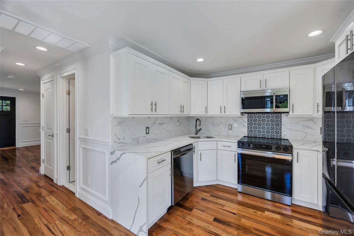 Interior, Kitchen, Marble Walls, Recessed Lighting, Stainless Steel Appliances, Wood Texture Flooring