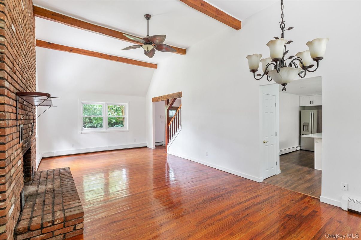 Chandelier, Empty room, Fireplace, Interior, Stone Walls, Wooden Beams, Wood Texture Flooring