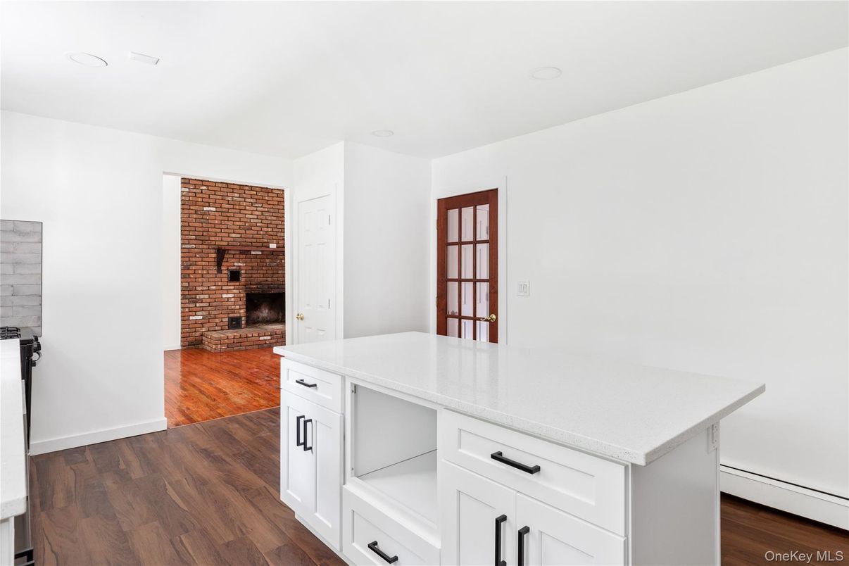 Fireplace, Interior, Kitchen, Recessed Lighting, Stone Walls, Wood Texture Flooring