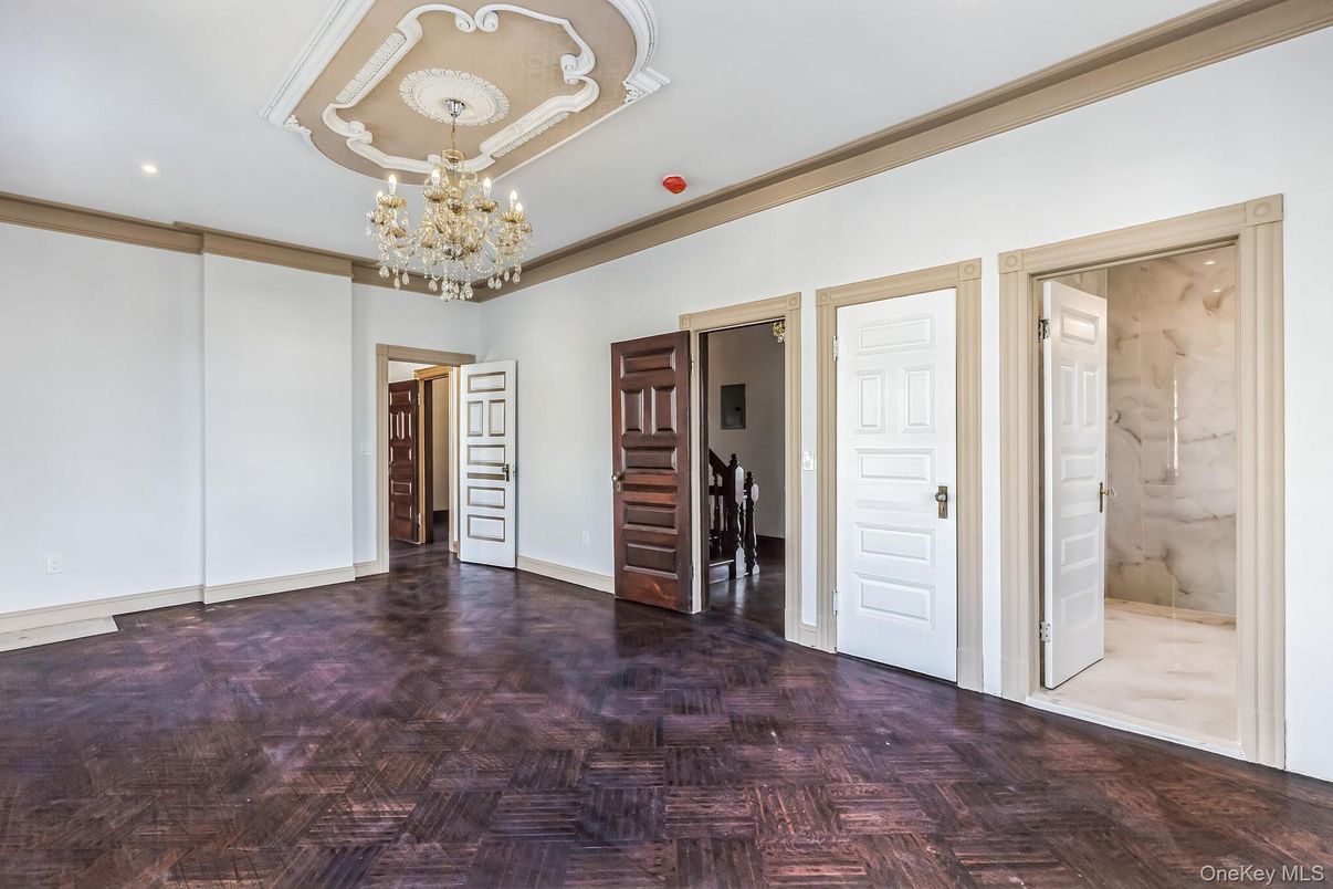 Chandelier, Empty room, Interior, Marble Walls, Recessed Lighting, Wood Texture Flooring