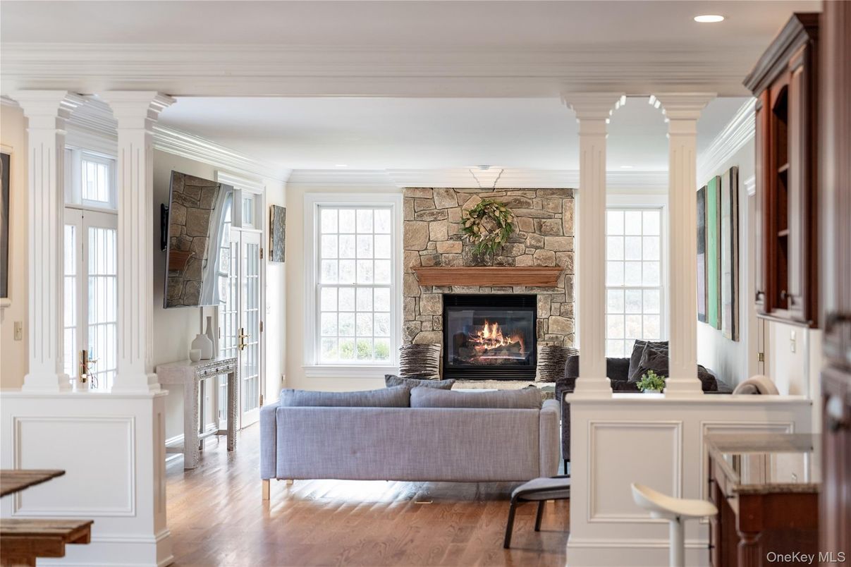 Fireplace, Interior, Living room, Recessed Lighting, Stone Walls, Wood Texture Flooring