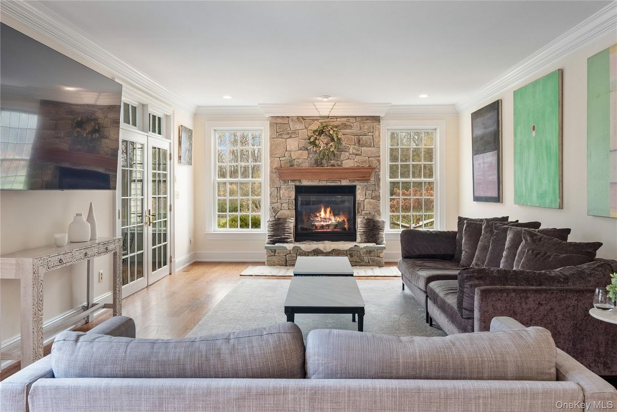 Fireplace, Interior, Living room, Recessed Lighting, Stone Walls, Wood Texture Flooring